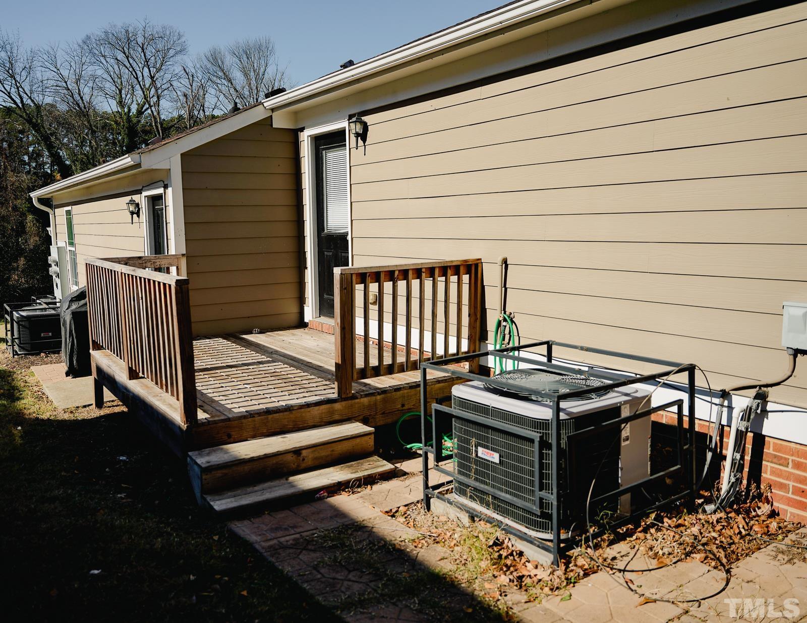 1320 South State Street, Unit A Raleigh, NC 27610 - Photo 18 of 20 a view of a roof deck with wooden floor and wooden fence