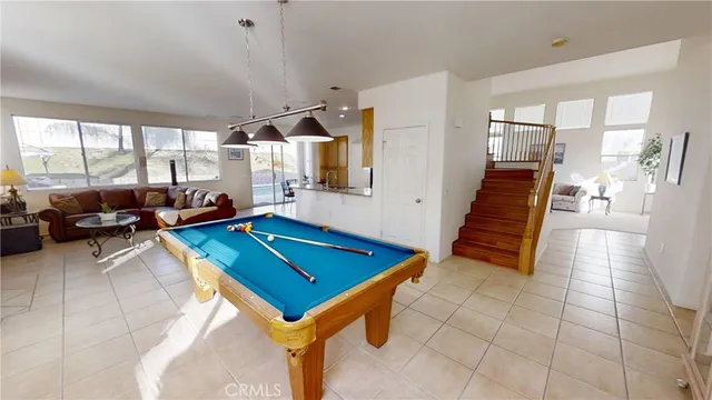 a room with lots of tables and a large window