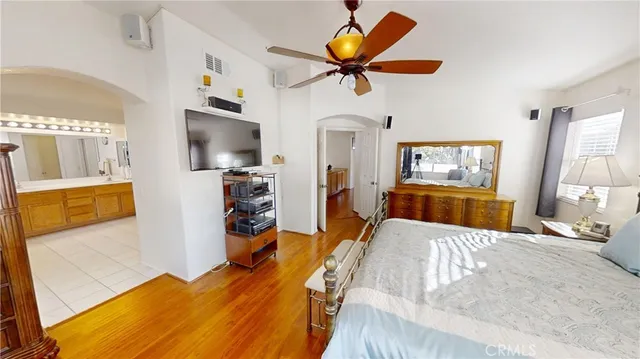 a spacious bathroom with a double vanity sink a mirror and a bathtub