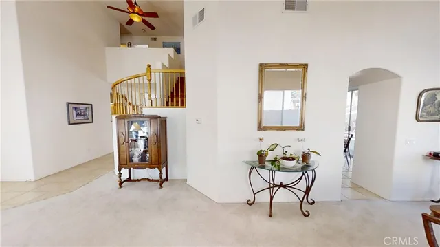 a living room with furniture and a chair