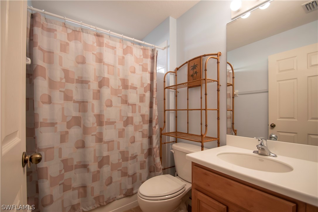 8879 Falcon Pointe Loop Fort Myers, FL 33912 - Photo 14 of 17 a bathroom with a sink toilet and shower
