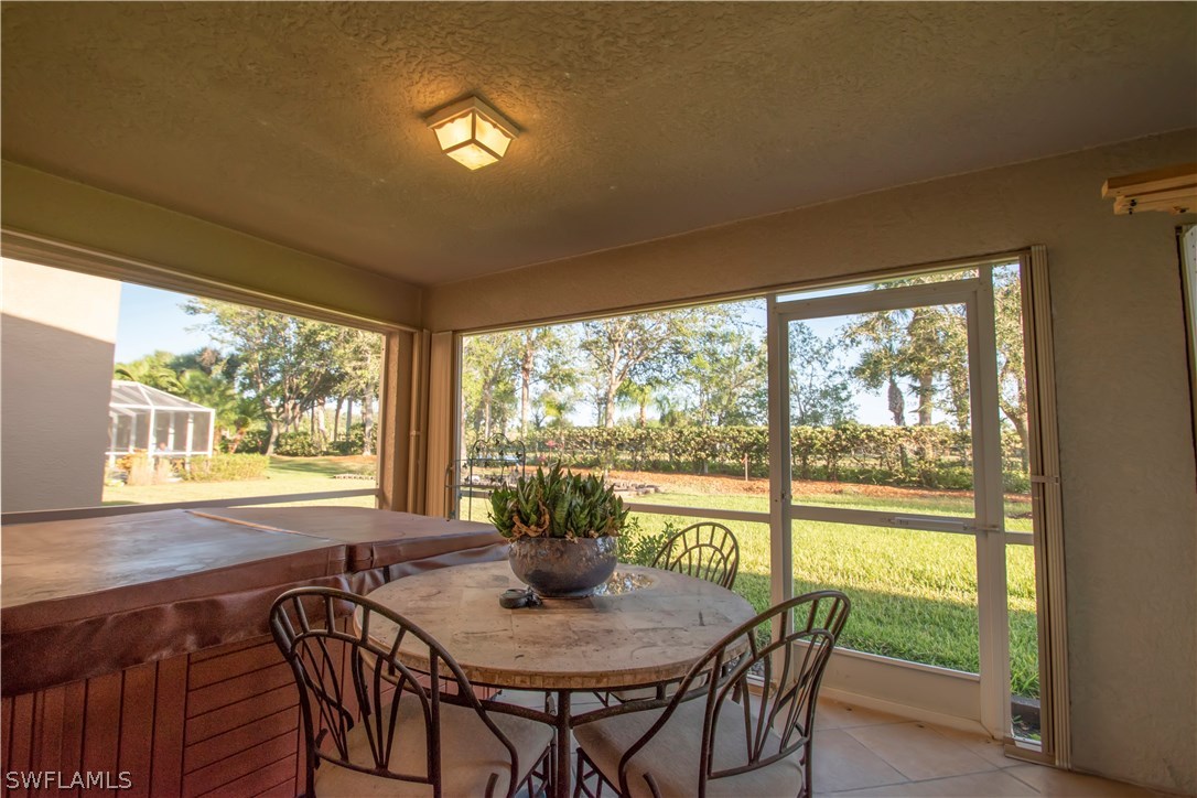 8879 Falcon Pointe Loop Fort Myers, FL 33912 - Photo 15 of 17 a view of a dining room with furniture window and outside view
