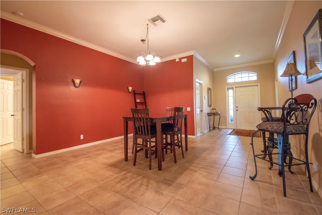8879 Falcon Pointe Loop Fort Myers, FL 33912 - Photo 7 of 17 a view of a dining room with furniture
