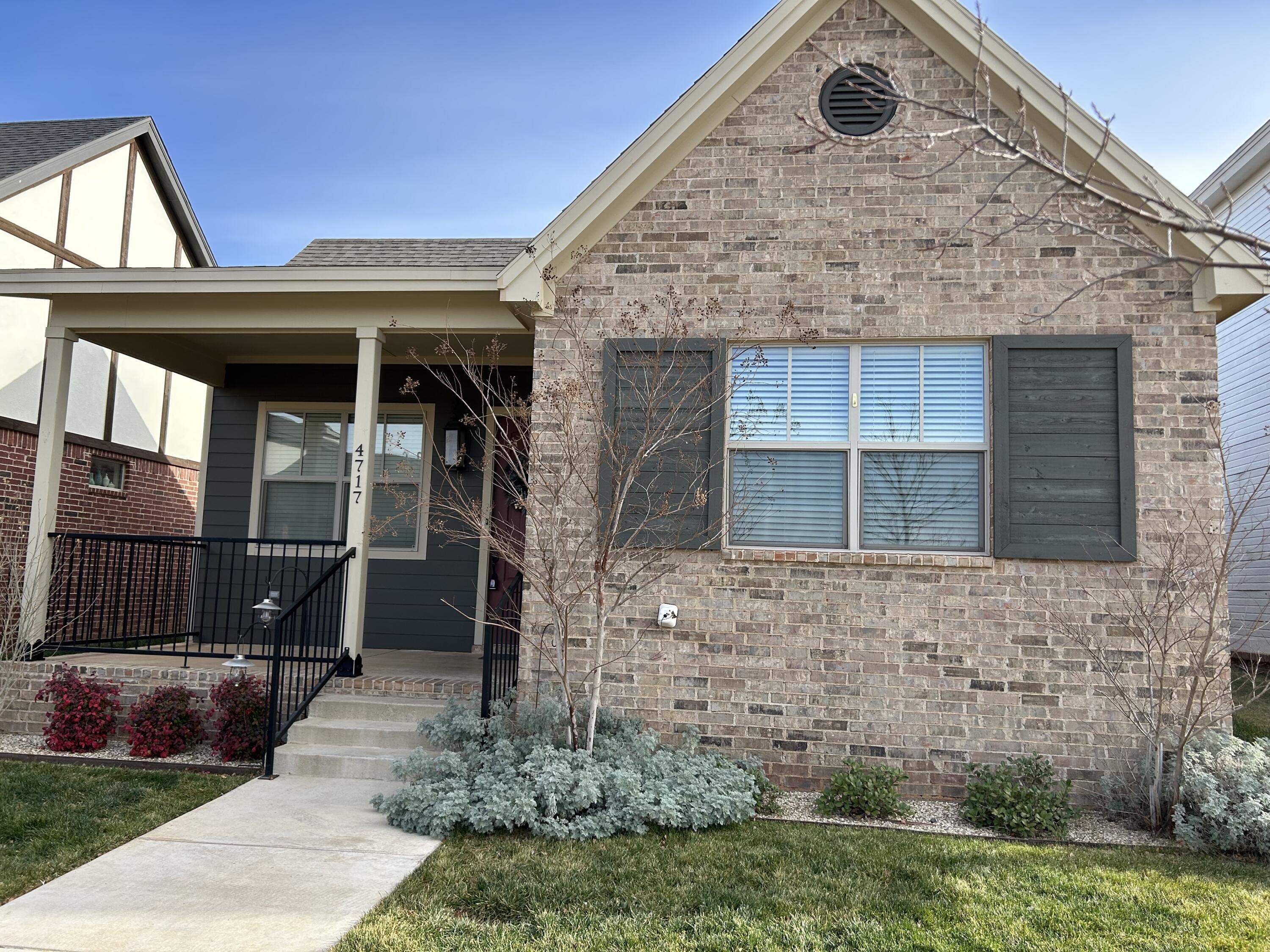 4717 121st Place Lubbock, TX 79424 - Photo 2 of 10 a front view of a house with a garden