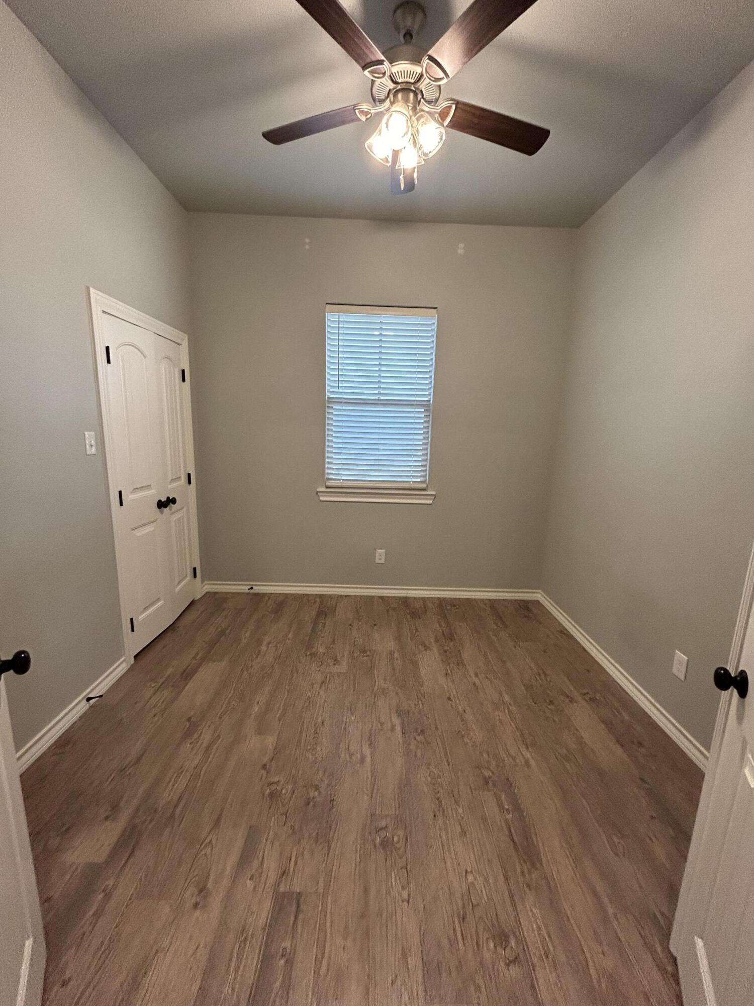 4717 121st Place Lubbock, TX 79424 - Photo 9 of 10 wooden floor in an empty room