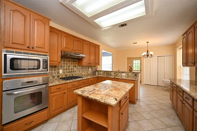 a kitchen with a stove and a microwave