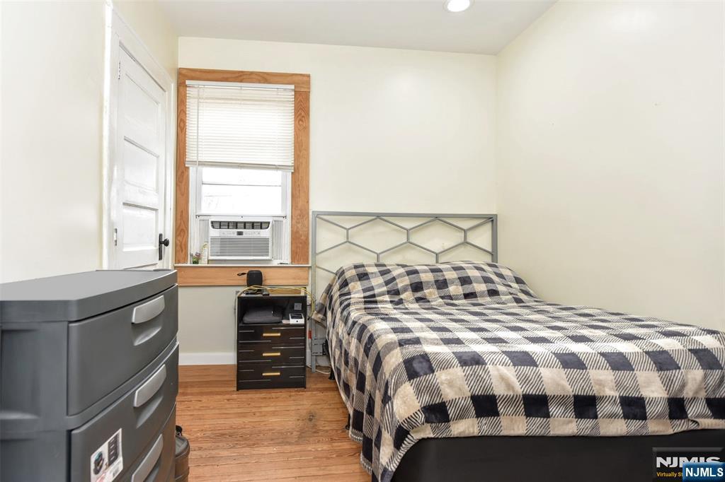 111 Teaneck Road Teaneck, NJ 07666 - Photo 14 of 22 a bedroom with a bed and a window