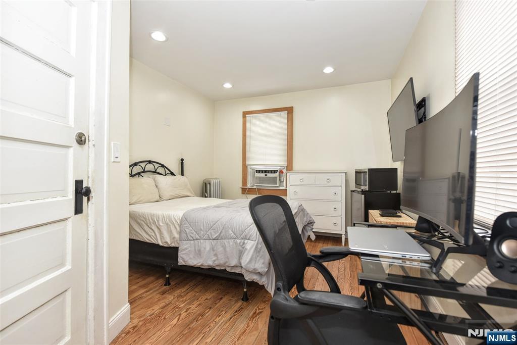 111 Teaneck Road Teaneck, NJ 07666 - Photo 15 of 22 a bedroom with a bed and a desk