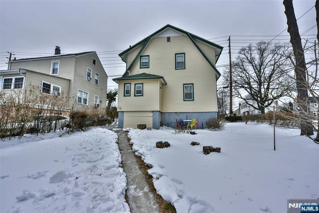 111 Teaneck Road Teaneck, NJ 07666 - Photo 20 of 22 a view of a house with a yard covered with snow in front of house