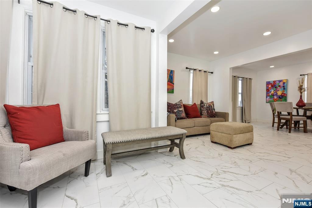 111 Teaneck Road Teaneck, NJ 07666 - Photo 4 of 22 a living room with furniture and a potted plant