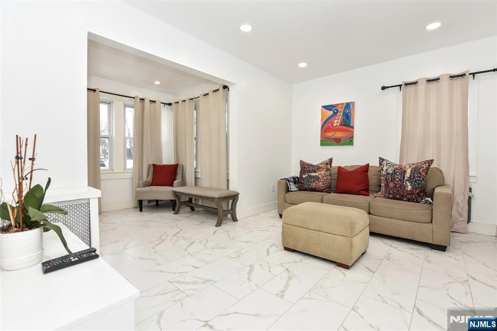 111 Teaneck Road Teaneck, NJ 07666 - Photo 5 of 22 a living room with furniture and a rug