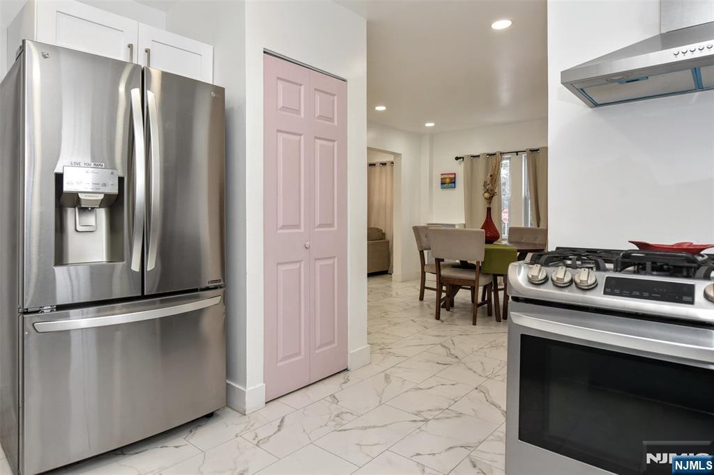 111 Teaneck Road Teaneck, NJ 07666 - Photo 8 of 22 a kitchen with stainless steel appliances granite countertop a refrigerator and a stove top oven
