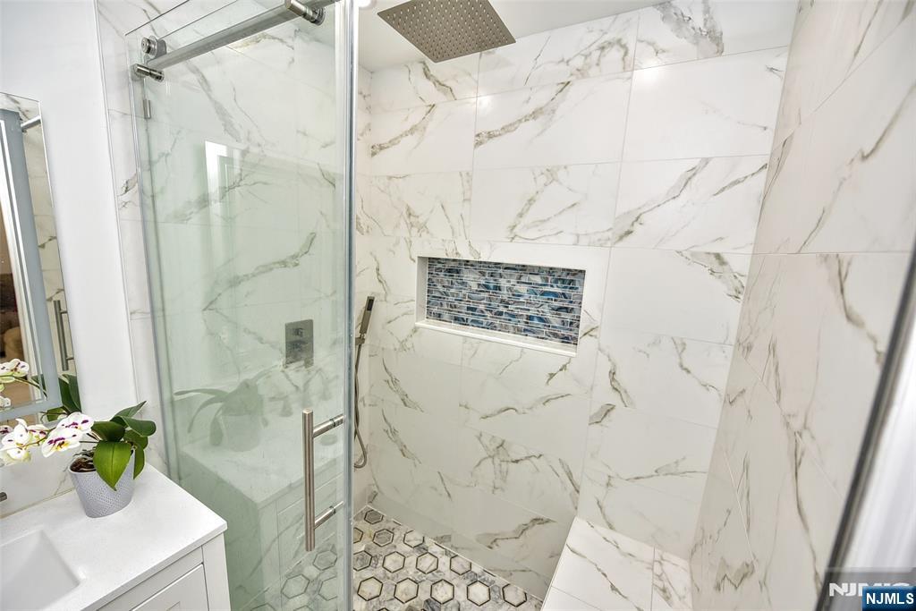 111 Teaneck Road Teaneck, NJ 07666 - Photo 10 of 22 a bathroom with a shower