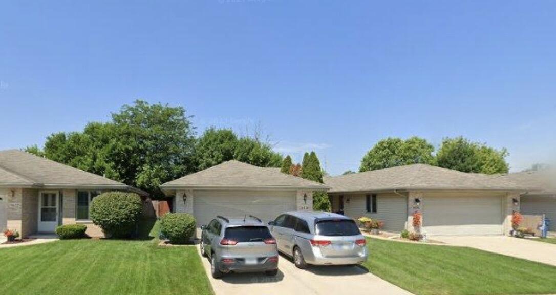 9418 Erie Street Highland, IN 46322 - Photo 4 of 4 a front view of a house with garden