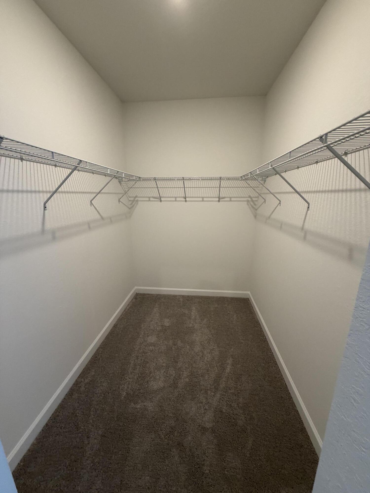 19407 Southwest 340th Street Homestead, FL 33034 - Photo 9 of 15 a view of a room with racks on the wall