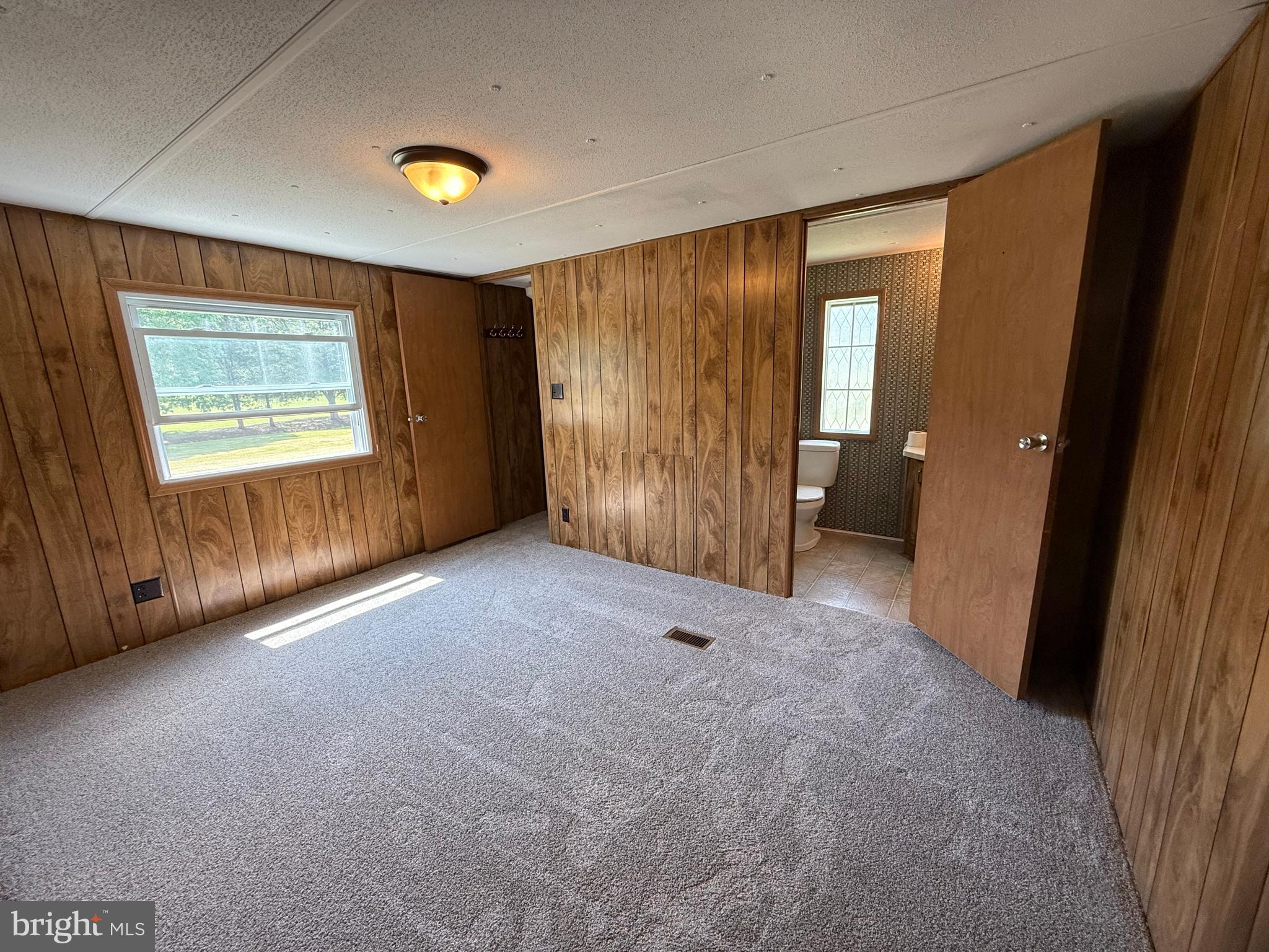 192 AA Rogers Road Augusta, WV 26704 - Photo 16 of 34 an empty room with windows and closet
