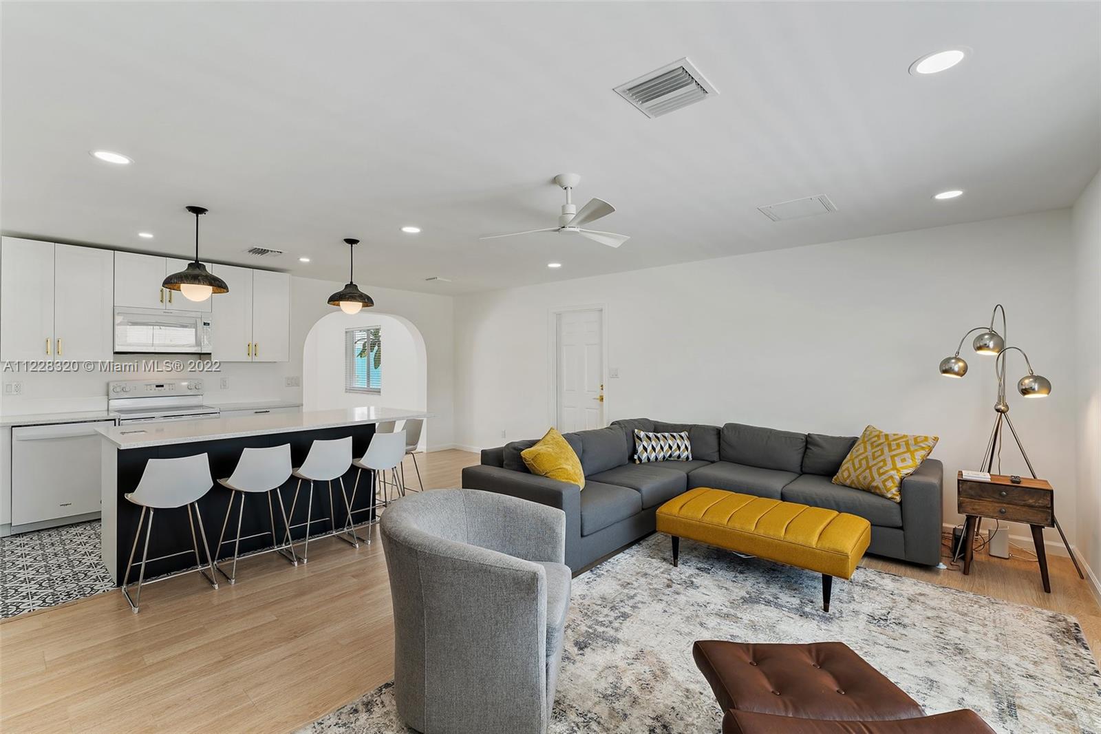 19 Shay Place Tequesta, FL 33469 - Photo 12 of 46 a living room with furniture and kitchen view