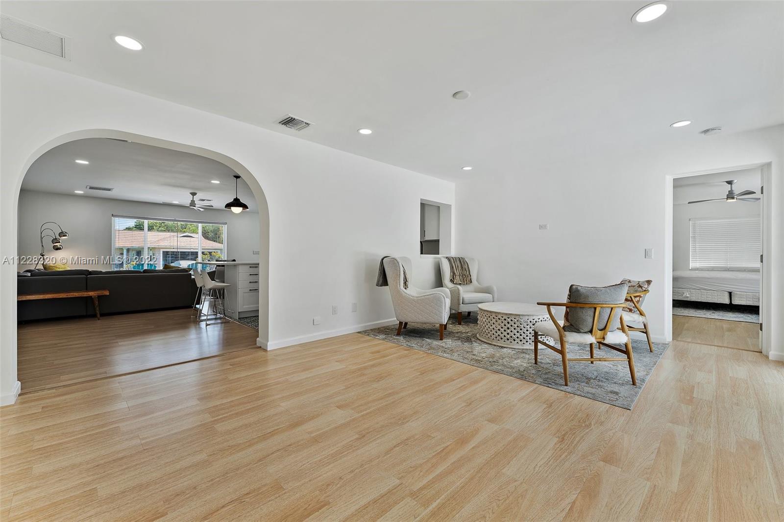 19 Shay Place Tequesta, FL 33469 - Photo 20 of 46 a living room with furniture and a wooden floor