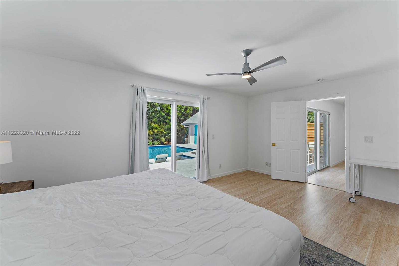 19 Shay Place Tequesta, FL 33469 - Photo 25 of 46 a bedroom with a bed and a window