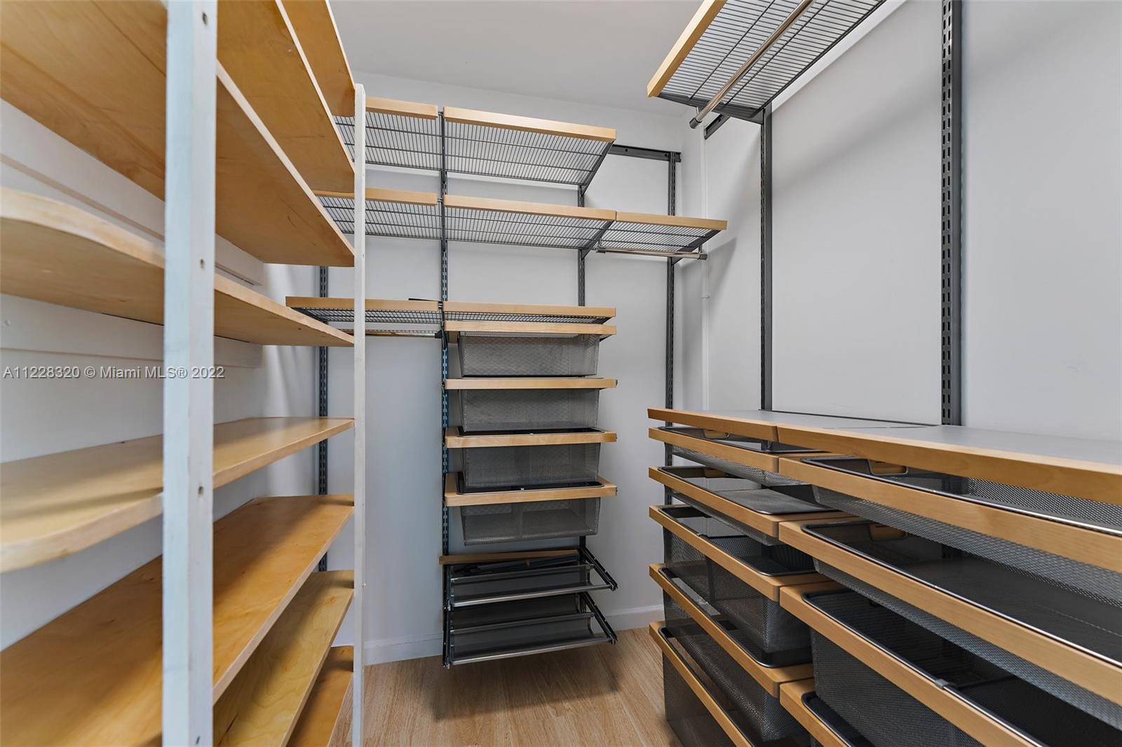 19 Shay Place Tequesta, FL 33469 - Photo 31 of 46 a view of walk in closet with empty racks