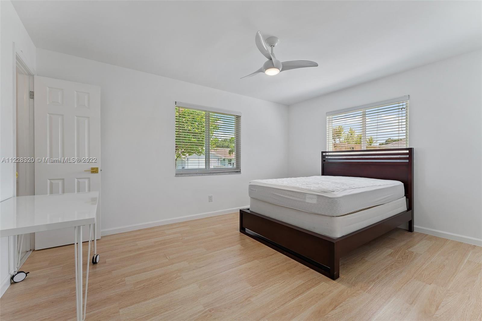 19 Shay Place Tequesta, FL 33469 - Photo 35 of 46 a bedroom with a bed and window