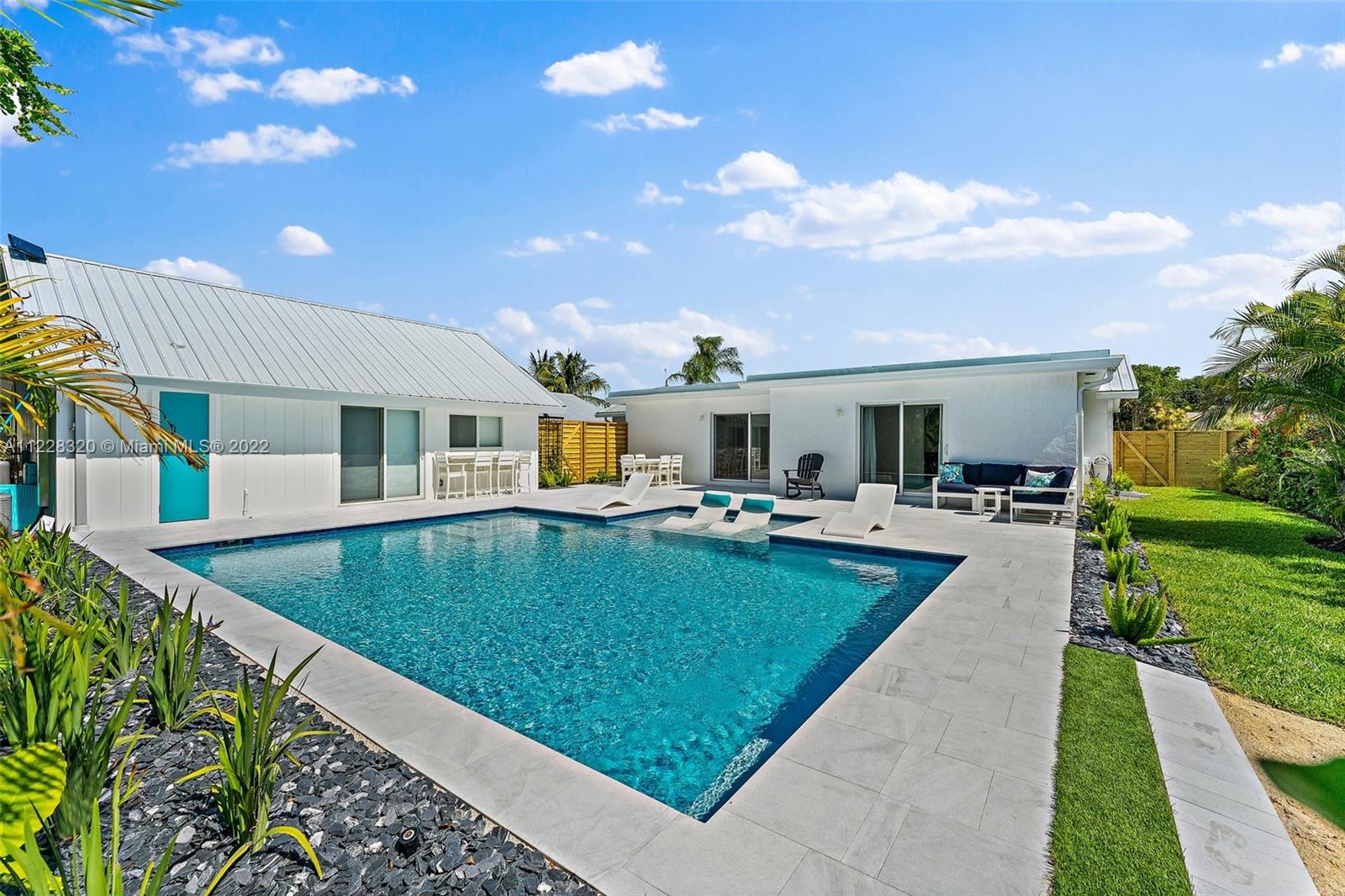 19 Shay Place Tequesta, FL 33469 - Photo 44 of 46 a view of a house with swimming pool and a yard