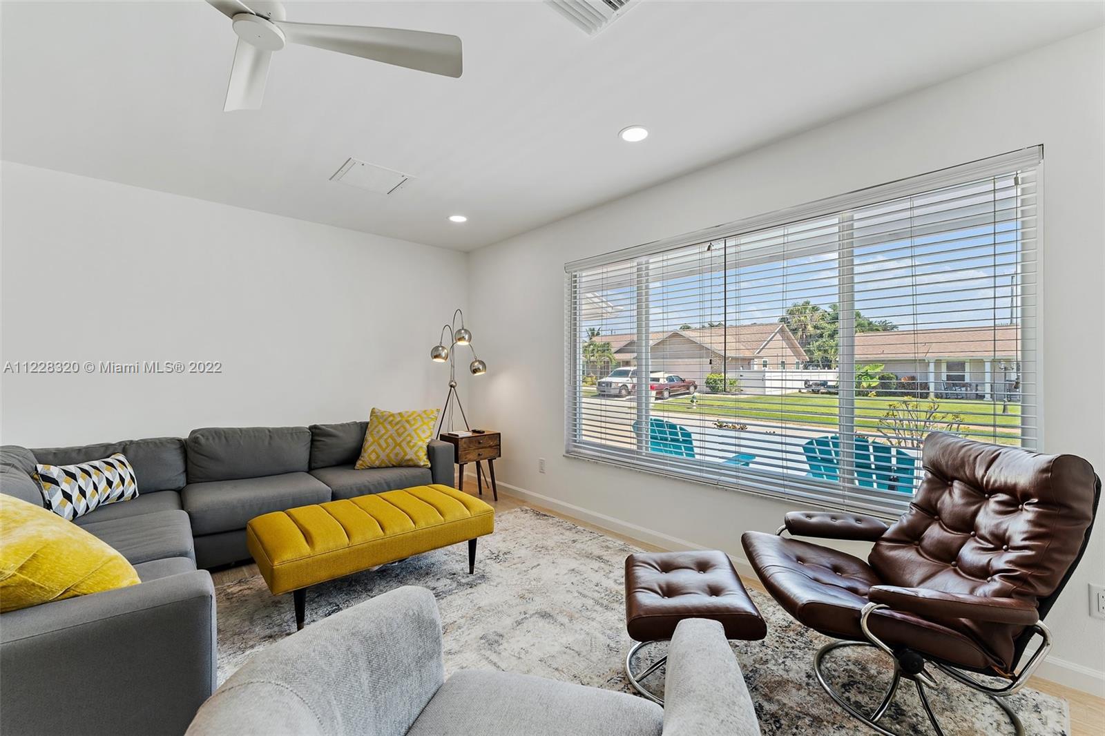 19 Shay Place Tequesta, FL 33469 - Photo 10 of 46 a living room with furniture and a large window