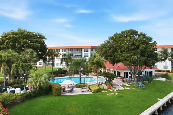 a view of a house with a yard porch and sitting area