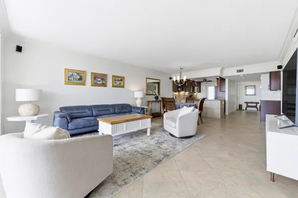 a living room with furniture and a table