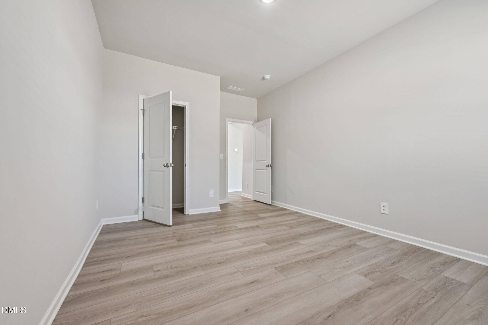 2145 Topsail Road Durham, NC 27703 - Photo 23 of 49 a view of an empty room with wooden floor
