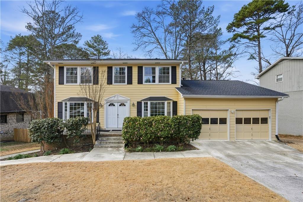 521 Rue Montaigne Stone Mountain, GA 30083 - Photo 1 of 1 front view of a house with a yard