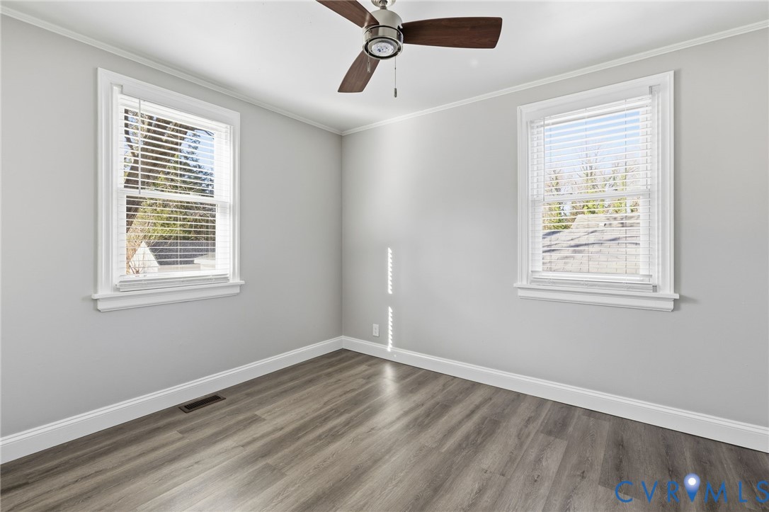 5009 Regent Road Richmond, VA 23230 - Photo 18 of 22 Unfurnished room with crown molding, wood finished