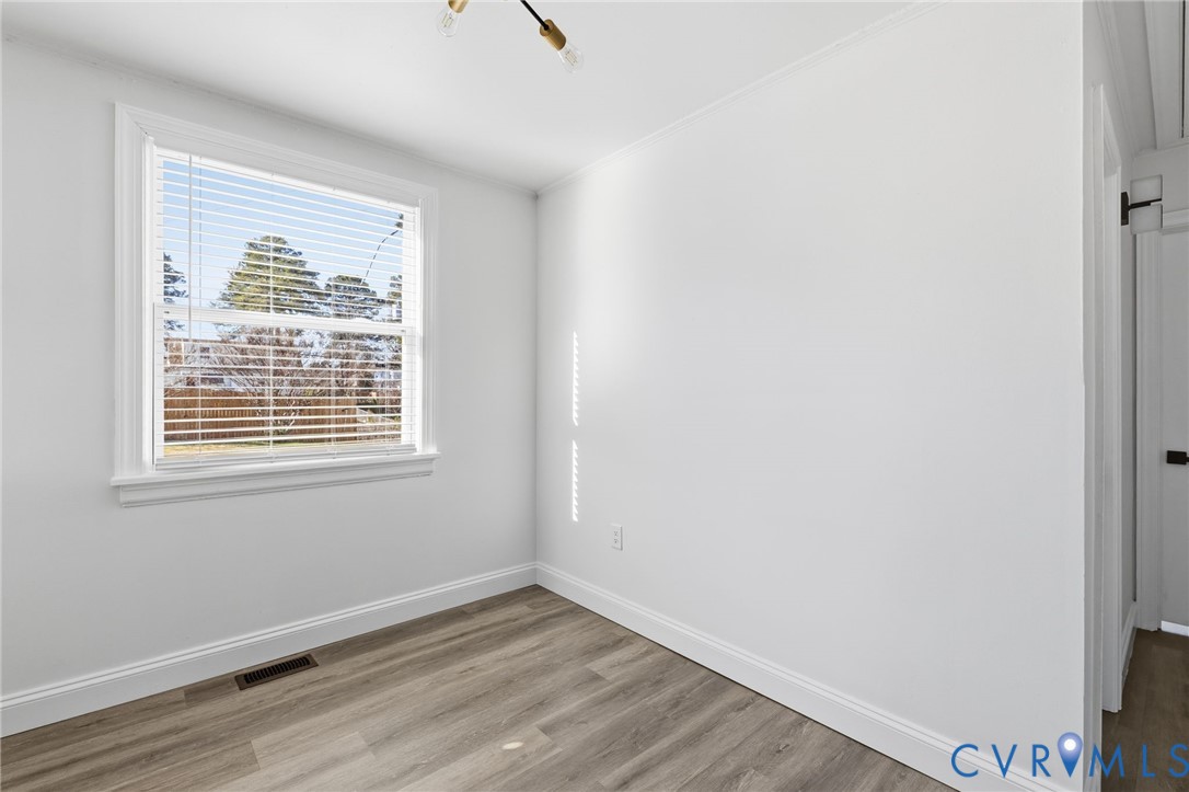 5009 Regent Road Richmond, VA 23230 - Photo 10 of 22 Empty room featuring light wood-style flooring and