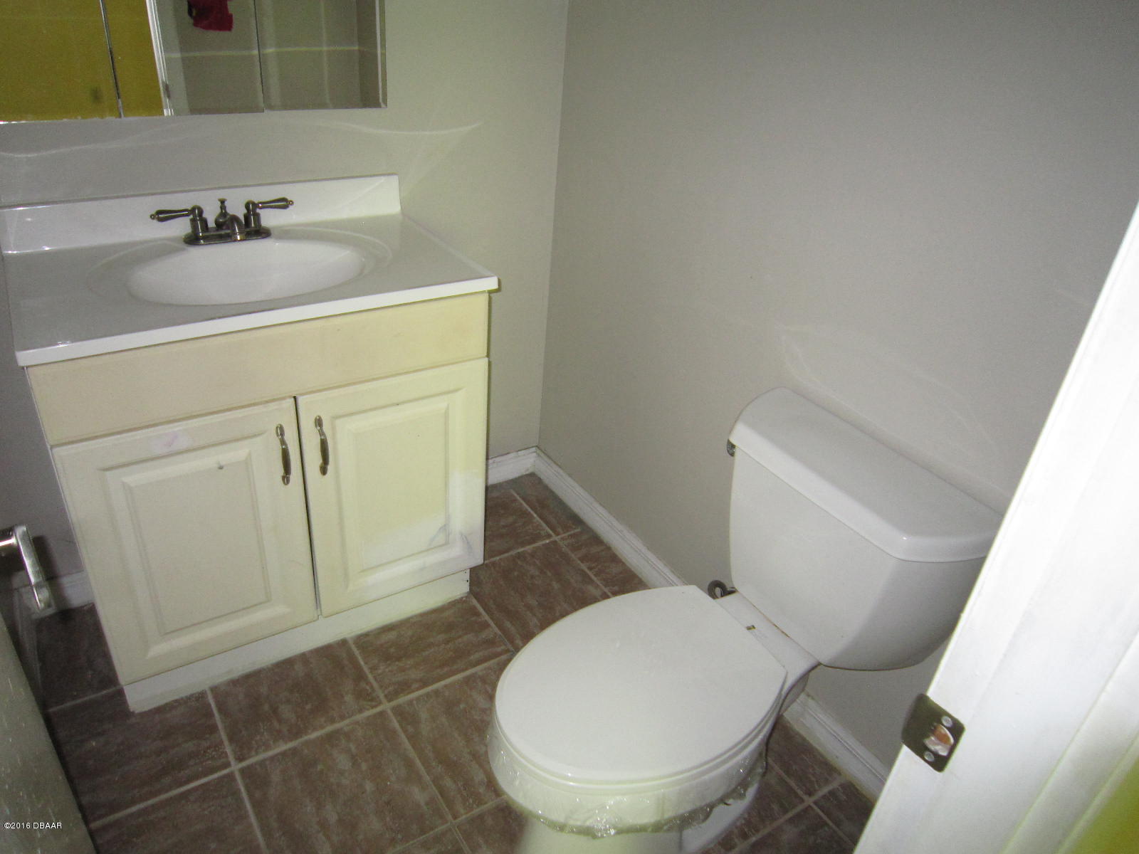 1706 Western Road South Daytona, FL 32119 - Photo 12 of 16 a bathroom with a toilet and a sink