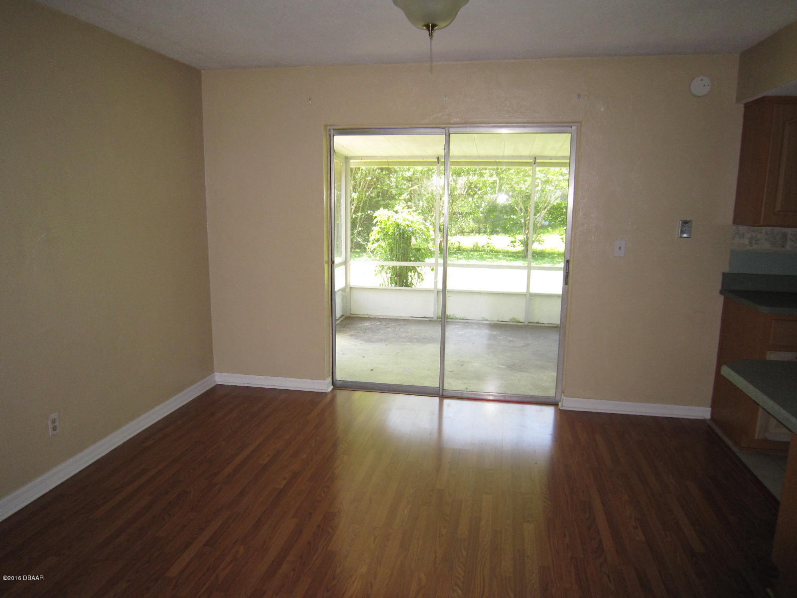 1706 Western Road South Daytona, FL 32119 - Photo 5 of 16 an empty room with wooden floor and windows