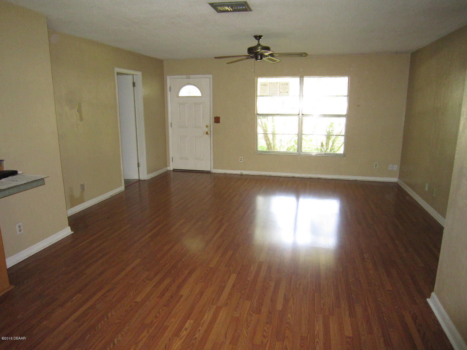 1706 Western Road South Daytona, FL 32119 - Photo 7 of 16 an empty room with wooden floor and windows