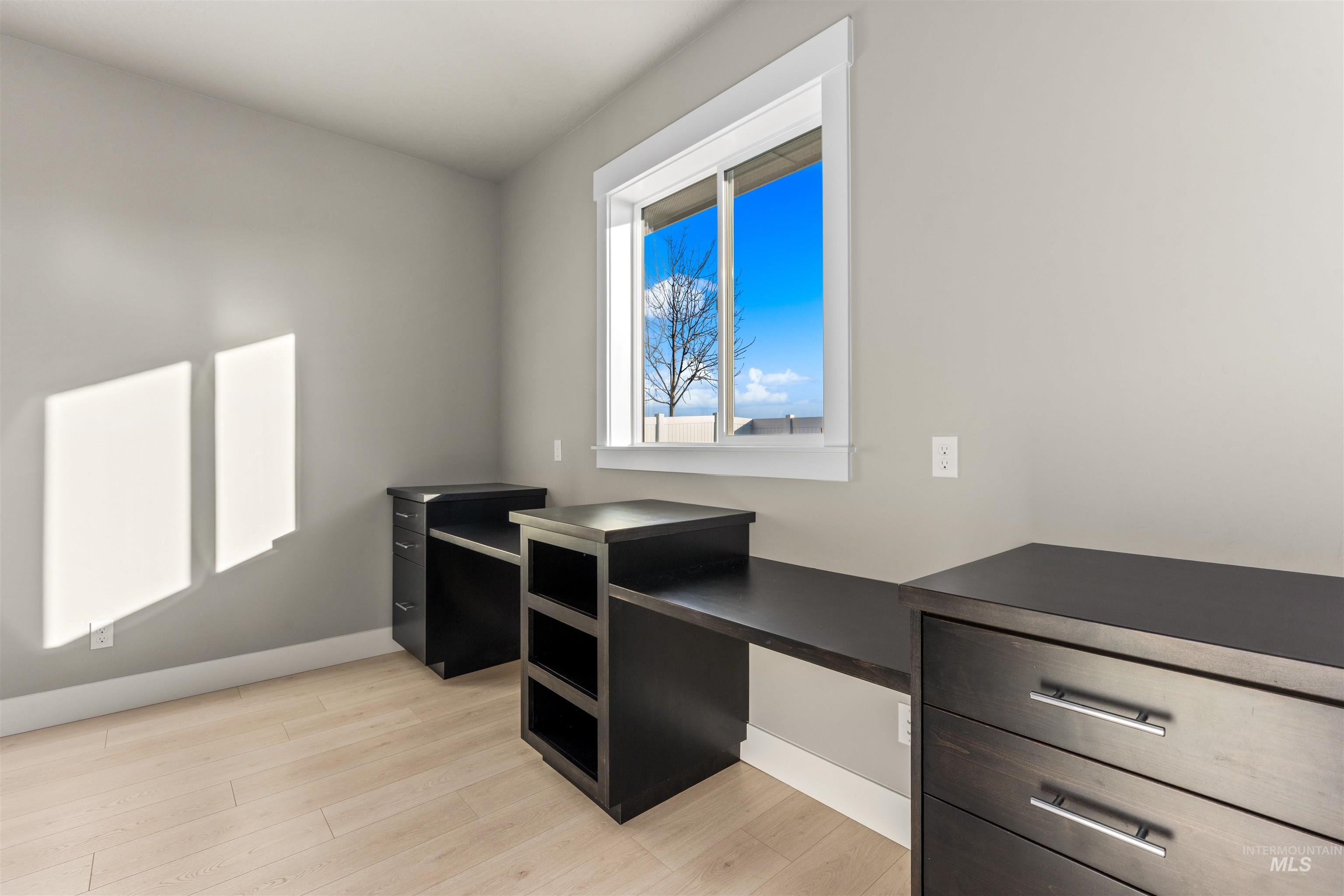 8081 Tandy Cove Street Middleton, ID 83644 - Photo 12 of 41 Home office featuring light wood-style floors and baseboards