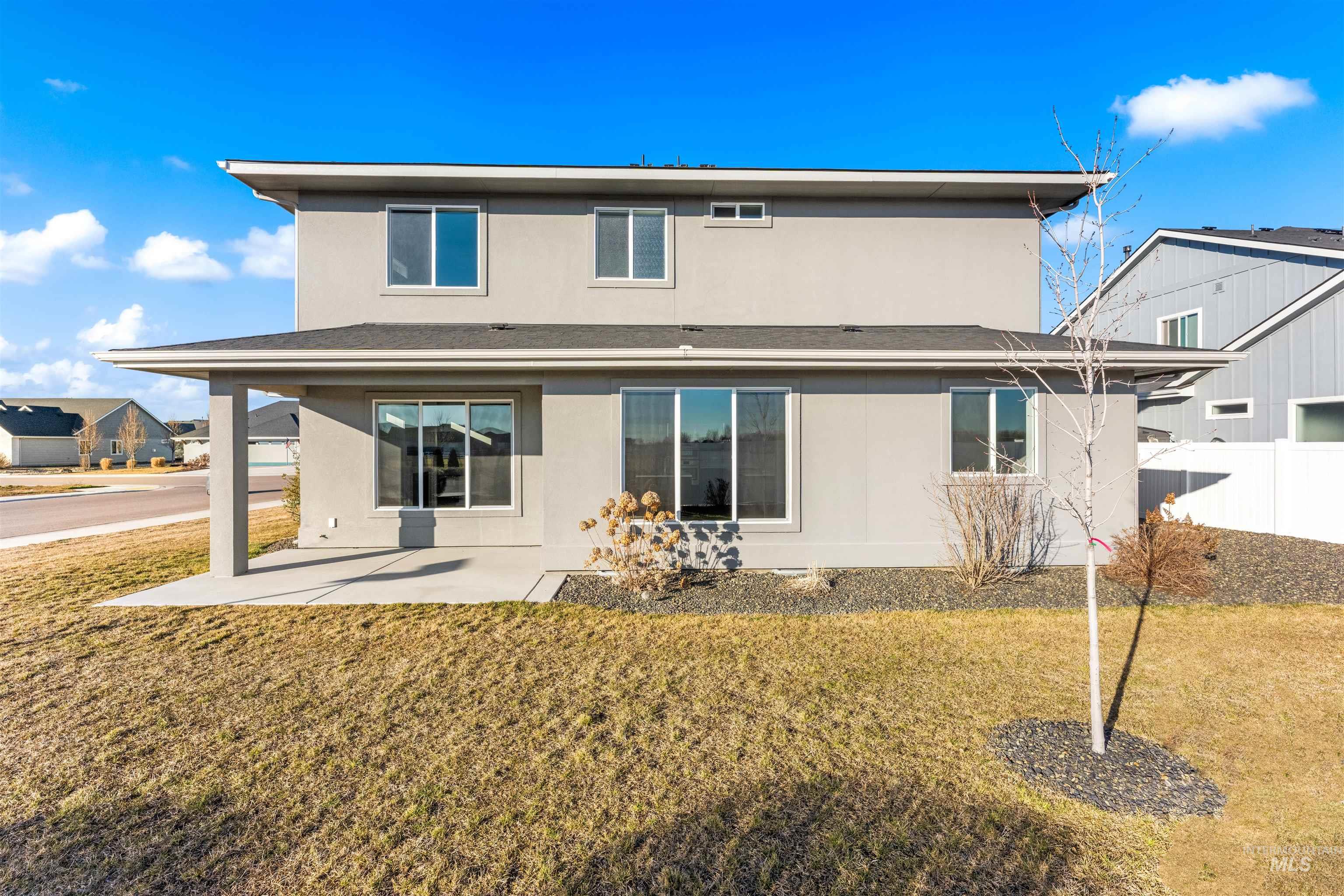 8081 Tandy Cove Street Middleton, ID 83644 - Photo 36 of 41 Rear view of house with stucco siding, a yard, and a patio