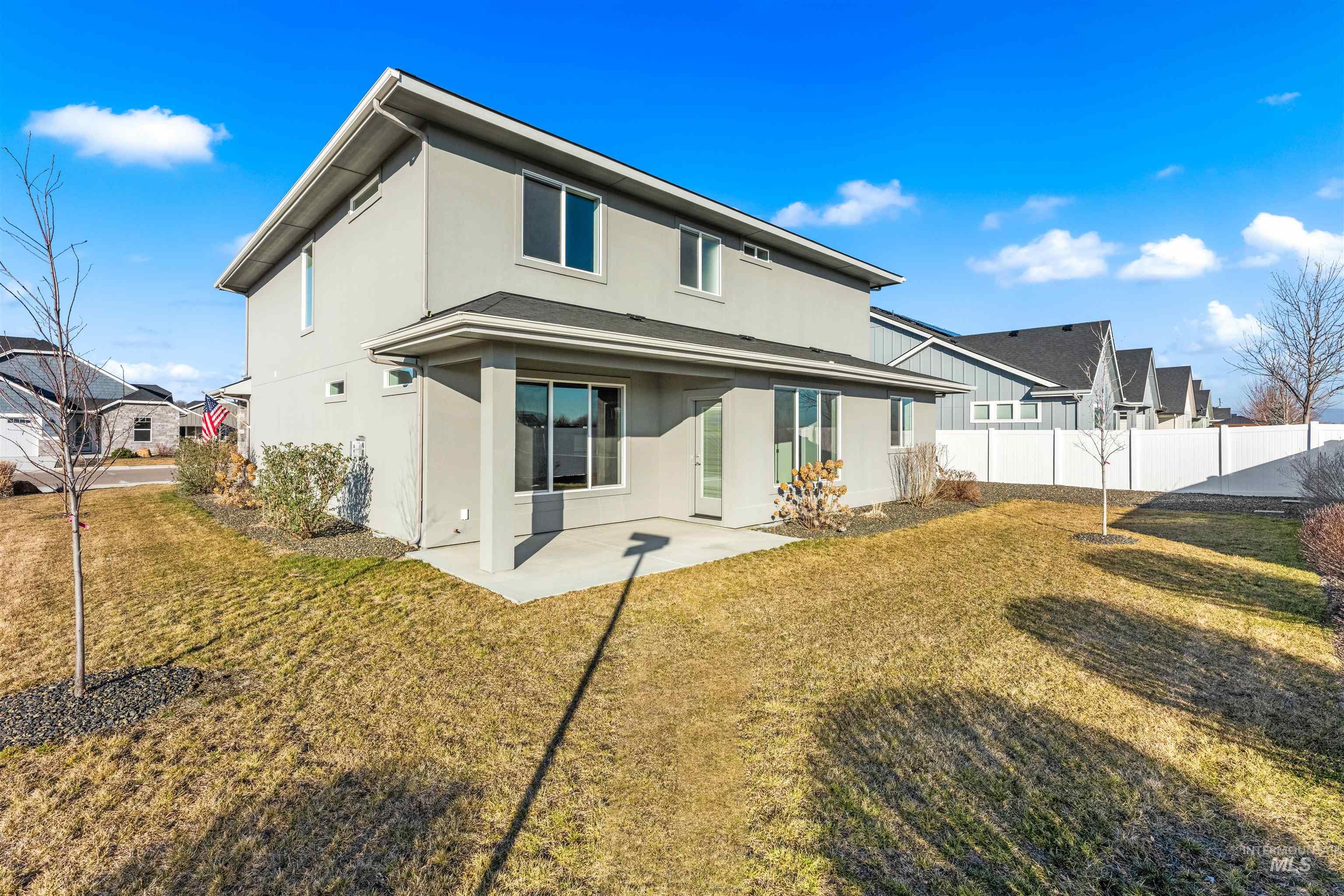 8081 Tandy Cove Street Middleton, ID 83644 - Photo 37 of 41 Rear view of property with stucco siding, a patio, and a residential view