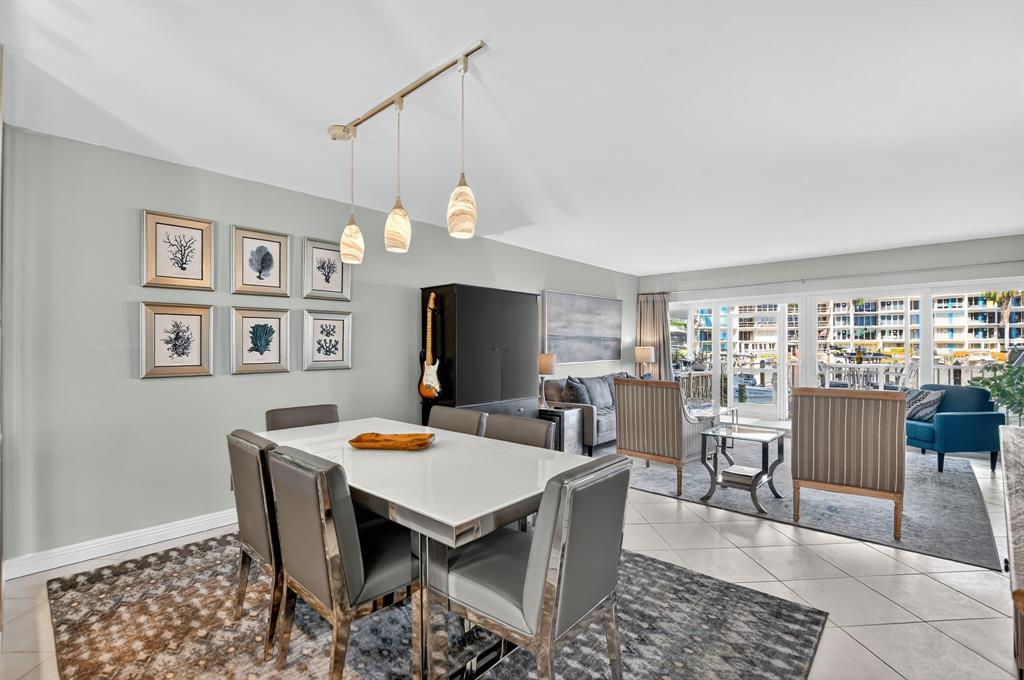 1537 East Hillsboro Boulevard, Unit 138 Deerfield Beach, FL 33441 - Photo 17 of 43 a view of a dining room with furniture