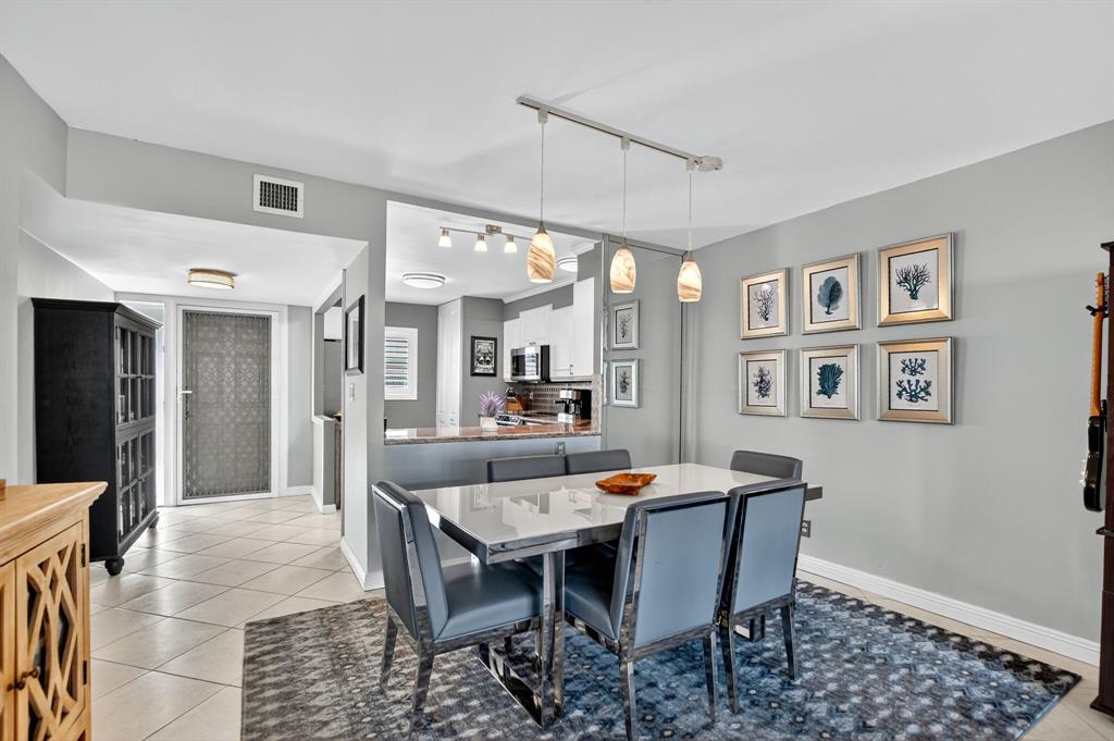 1537 East Hillsboro Boulevard, Unit 138 Deerfield Beach, FL 33441 - Photo 18 of 43 a dining room with furniture and window