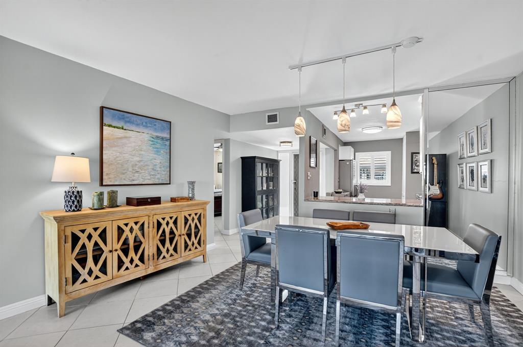 1537 East Hillsboro Boulevard, Unit 138 Deerfield Beach, FL 33441 - Photo 19 of 43 a view of a dining room with furniture window and wooden floor