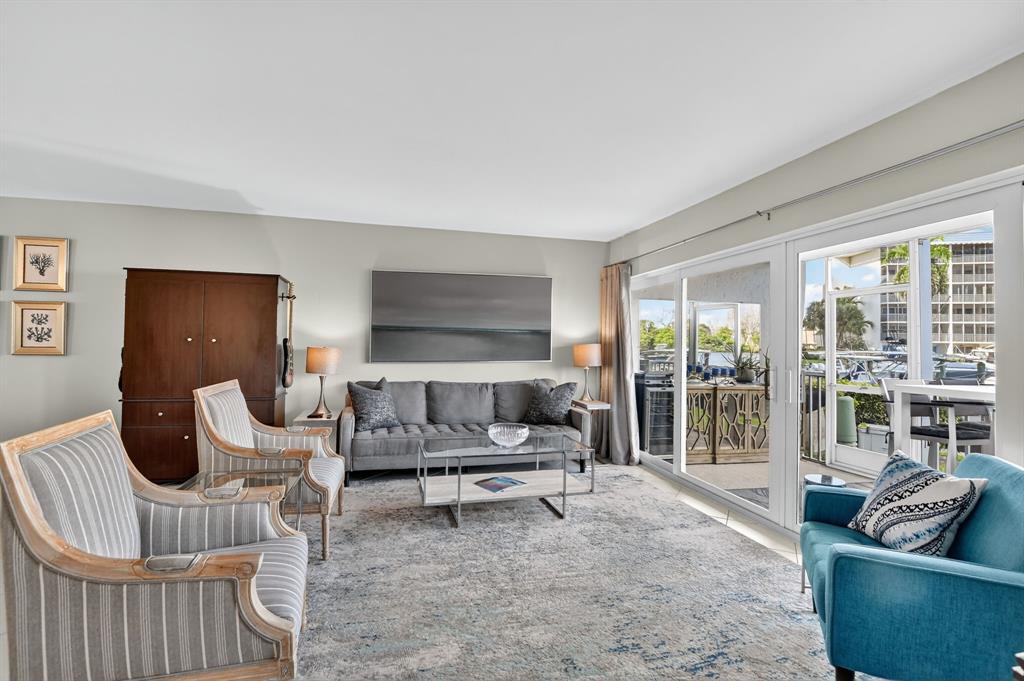 1537 East Hillsboro Boulevard, Unit 138 Deerfield Beach, FL 33441 - Photo 22 of 43 a living room with furniture and a large window