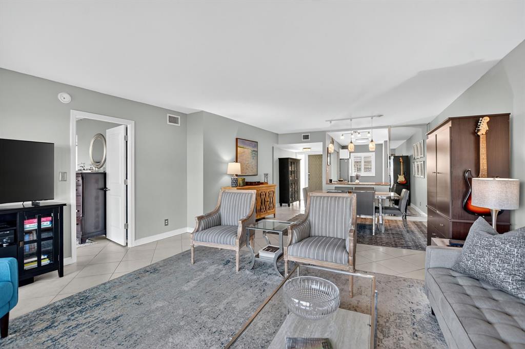 1537 East Hillsboro Boulevard, Unit 138 Deerfield Beach, FL 33441 - Photo 23 of 43 a living room with furniture and a flat screen tv