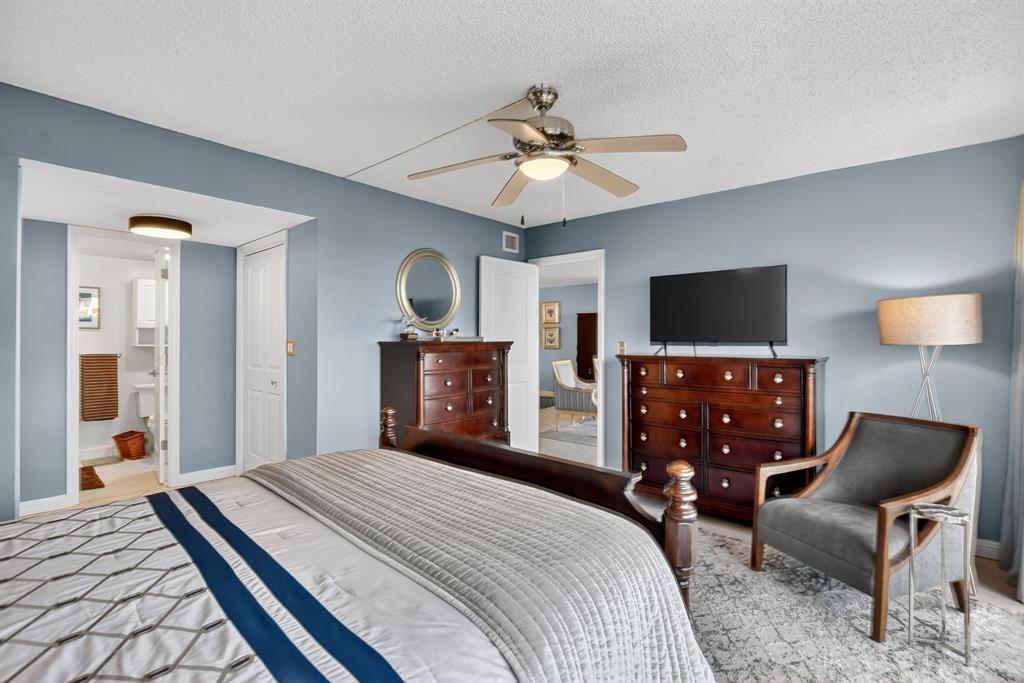 1537 East Hillsboro Boulevard, Unit 138 Deerfield Beach, FL 33441 - Photo 25 of 43 a bedroom with a bed and a flat screen tv