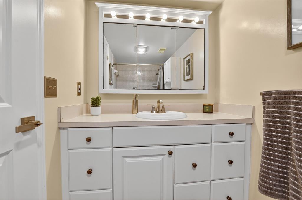 1537 East Hillsboro Boulevard, Unit 138 Deerfield Beach, FL 33441 - Photo 27 of 43 a bathroom with a sink vanity and mirror