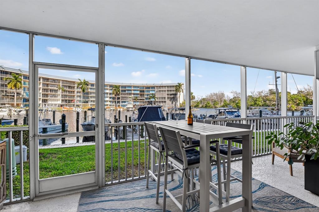 1537 East Hillsboro Boulevard, Unit 138 Deerfield Beach, FL 33441 - Photo 37 of 43 a view of a dining room with furniture window and garden view