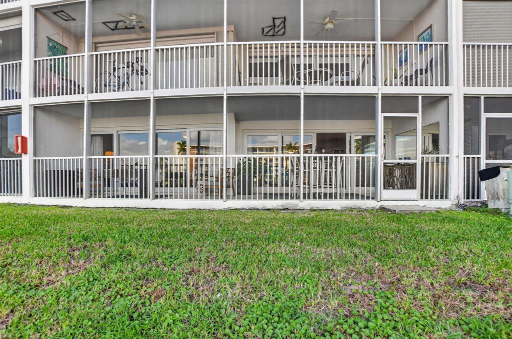 1537 East Hillsboro Boulevard, Unit 138 Deerfield Beach, FL 33441 - Photo 39 of 43 a view of a house with a backyard