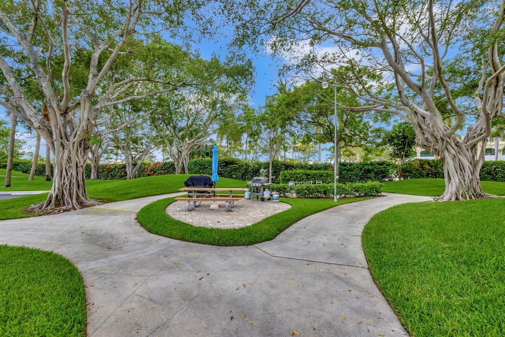 1537 East Hillsboro Boulevard, Unit 138 Deerfield Beach, FL 33441 - Photo 42 of 43 a view of a garden with tree