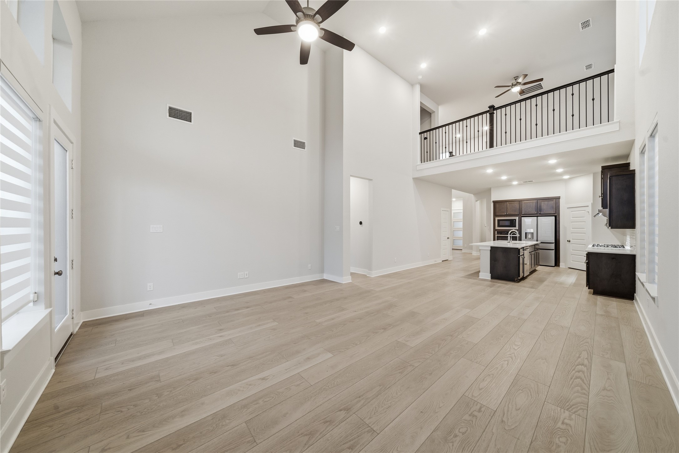 31719 Hatcher Grv Lane Fulshear, TX 77441 - Photo 16 of 40 a view of a livingroom with a kitchen
